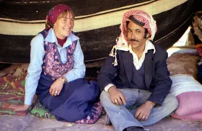 Marguerite and Mohammad sitting in front of a Bedouin tent